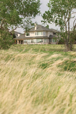 Open fields border this home, now transformed into a personalized space of sustainability and natural beauty.